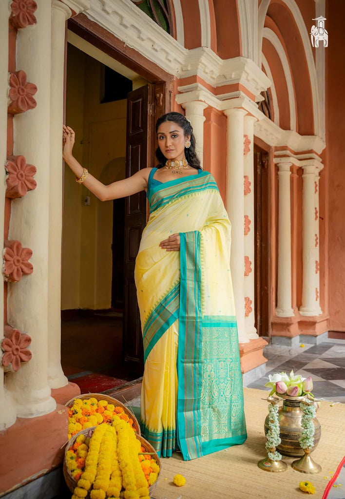 Light Yellow Pure Kanjivaram Silk Saree with Persian Green Border