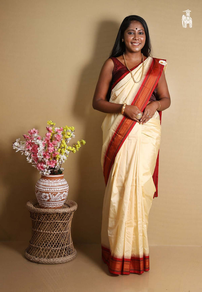 Off White Kanjivaram Silk Saree with Red Border